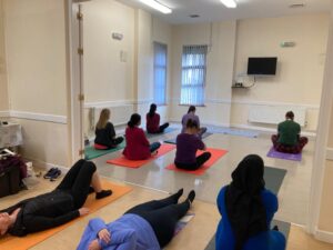 Parents taking part in yoga at Coolcotts Community Centre